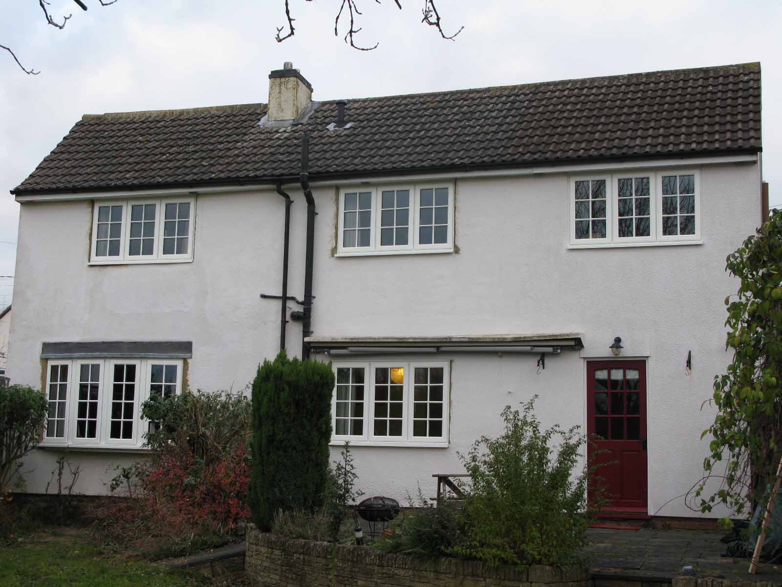A white house with Georgian windows.