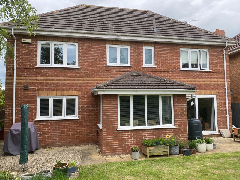 House with white flush casement windows