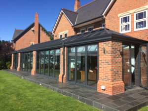 Solid Roof House Extensions with Bi-Fold doors