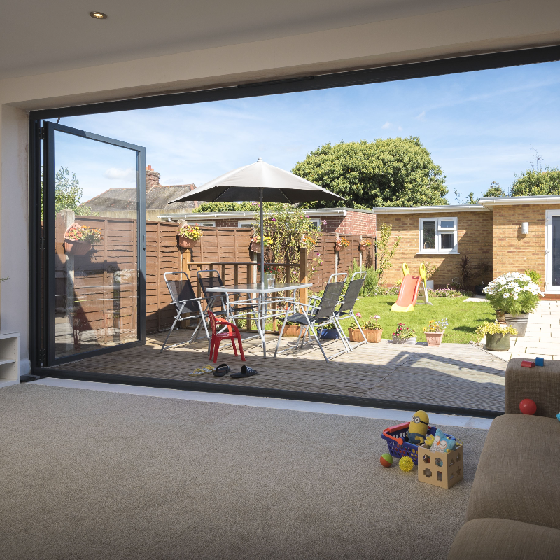 bifold doors from Origin fitted into lounge opening up to the garden