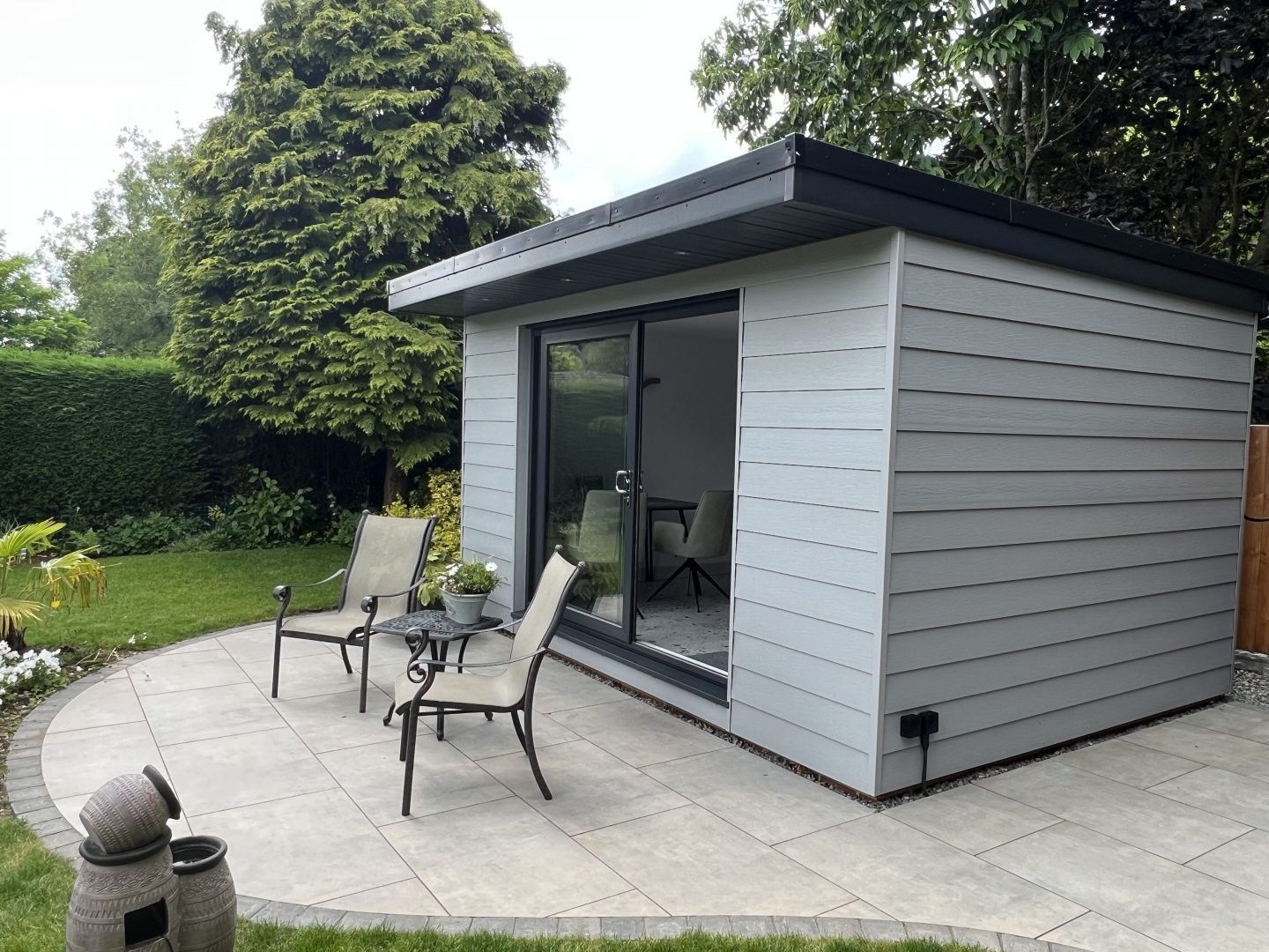 grey garden room with chairs outside