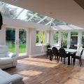 glass extension with sofa and dining table
